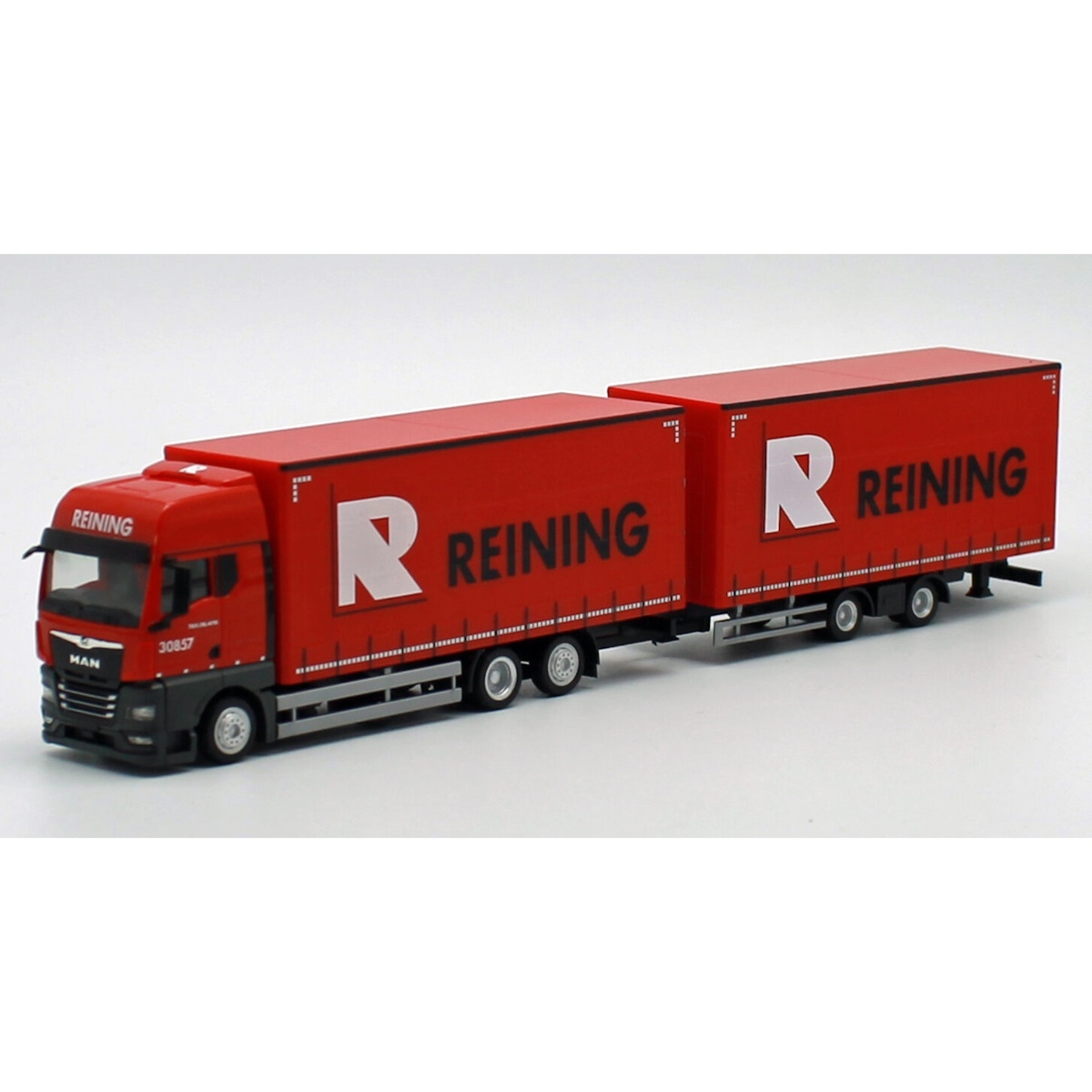 955010 - Herpa - MAN TGX GX with tandem curtainside truck/trailer  "Reining" NL