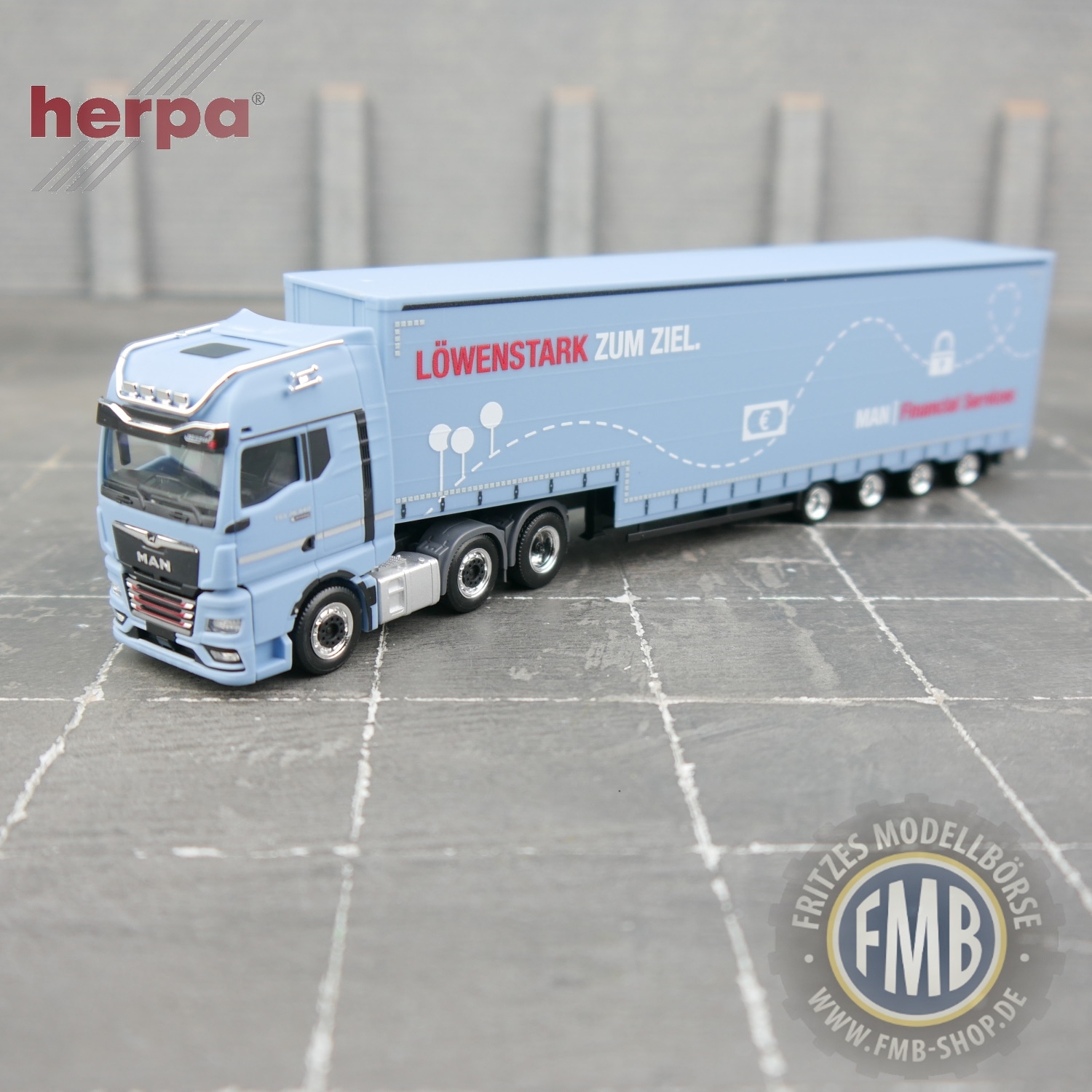 951326 - Herpa - MAN TGX GX 26.640 with Optiview and Meusburger semitrailer "MAN Financial Service"