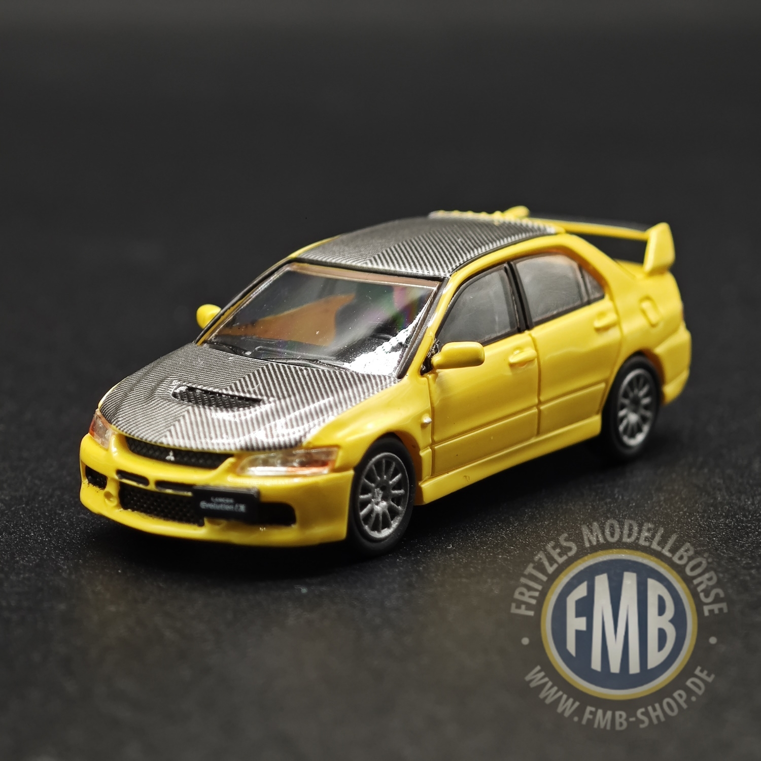 64115 - Micro City 87 - Mitsubishi Lancer Evo9, gelb - Carbon