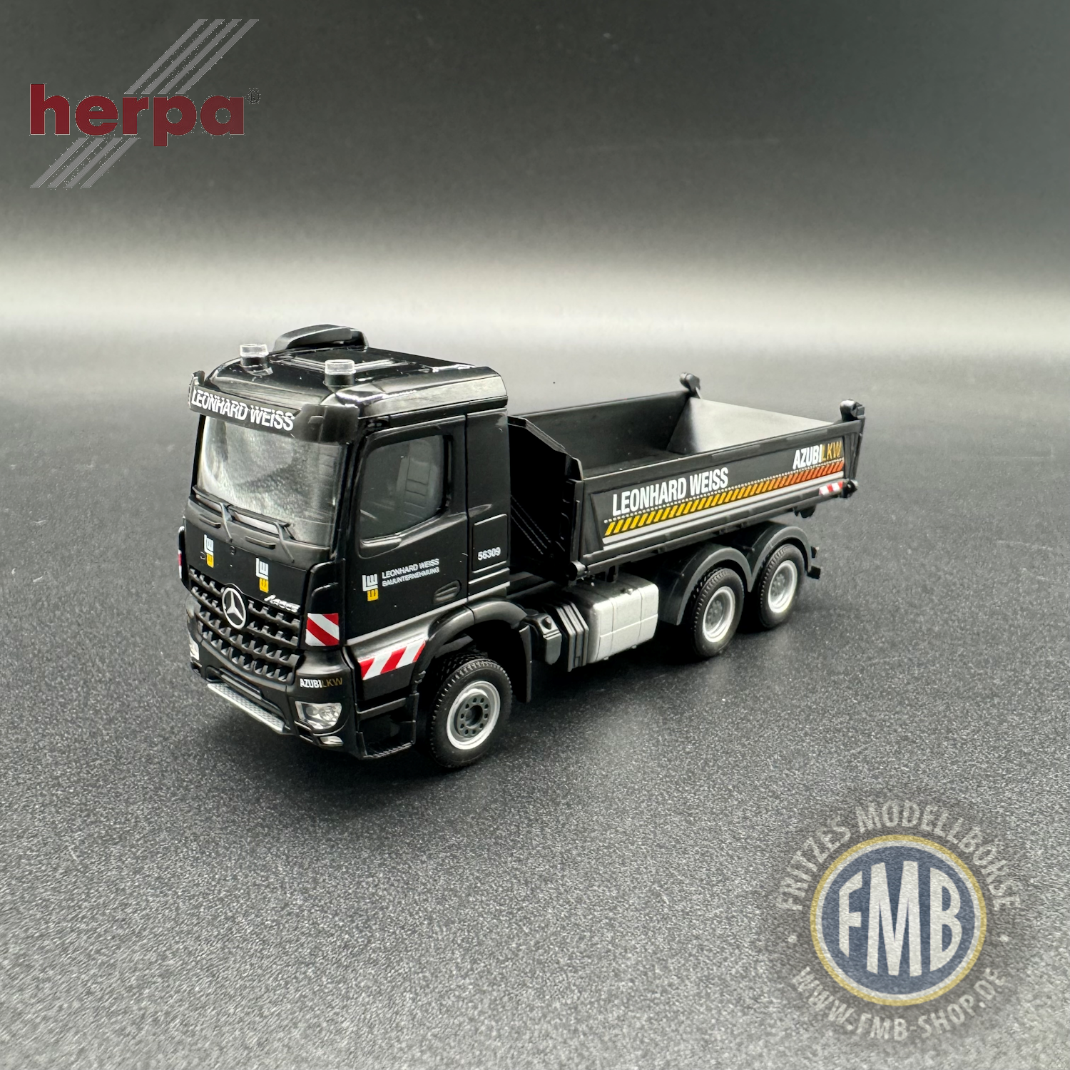 952408 - Herpa - Mercedes-Benz Arocs M tipper 3-axle - Leonhard Weiss/training -