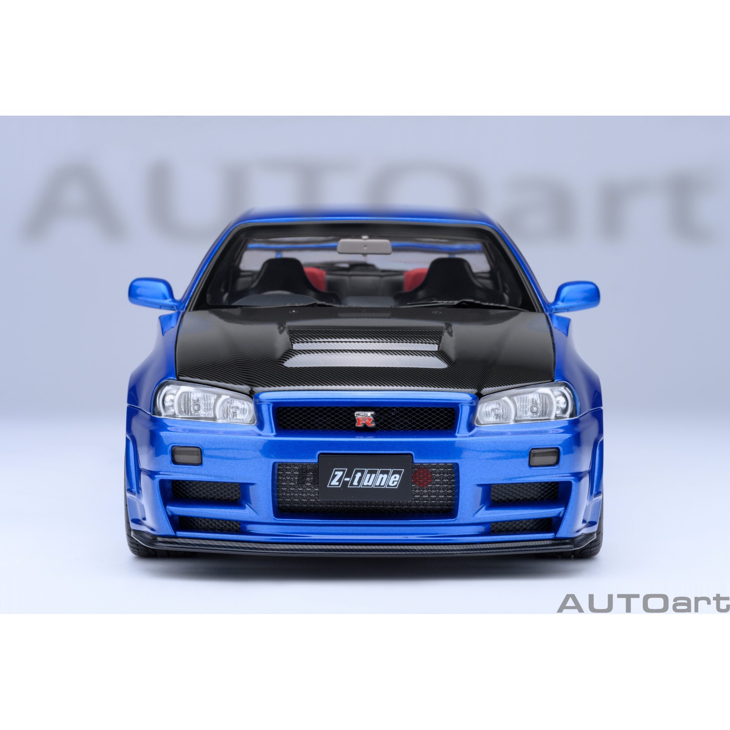 73460 - Autoart - Nissan Skyline GT-R (R34) Z-tune, bayside blau mit Carbon-Motorhaube