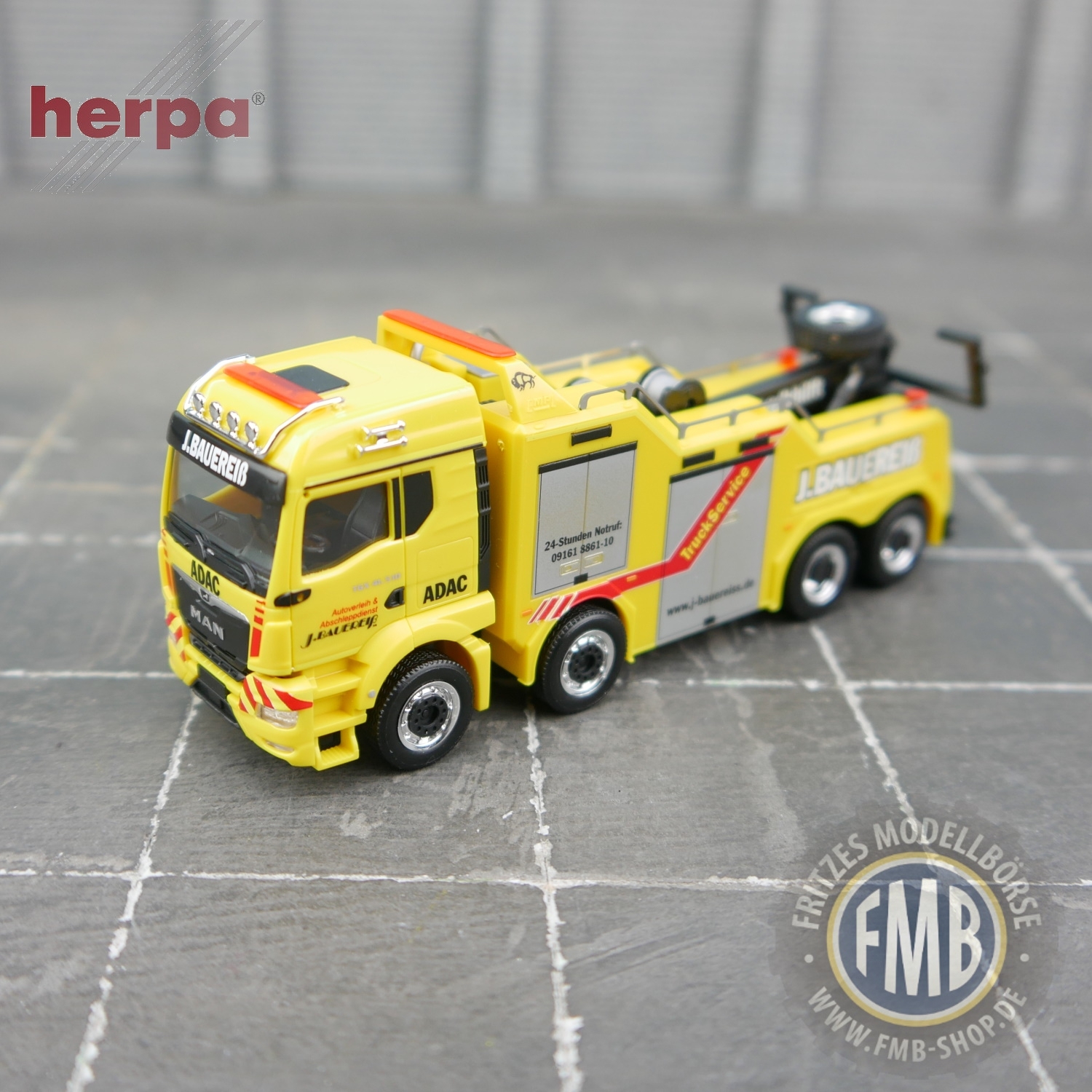 950565 - Herpa - MAN TGS TM 41.510 Empl Bison tow truck "Bauereiß"