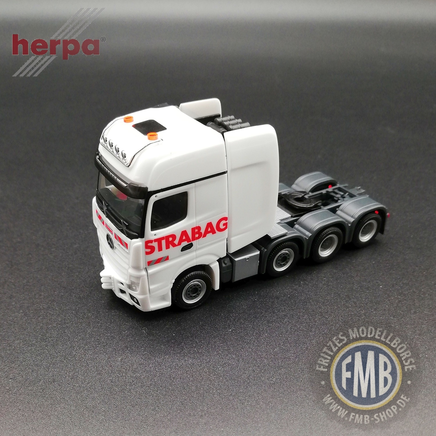 317412a - Herpa - Mercedes-Benz Actros SLT GigaSpace Schwerlast-Zugmaschine "Strabag"