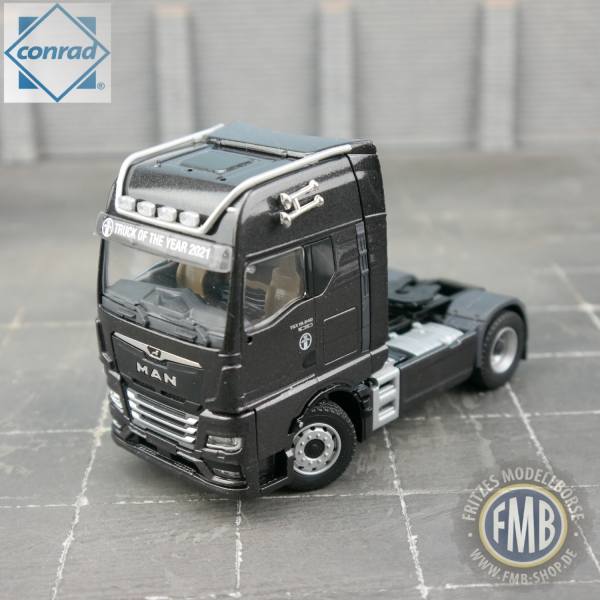 80000/05 - Conrad - MAN TGX GX 18.640 Zugmaschine "Truck of the Year 2021", schwarz metallic